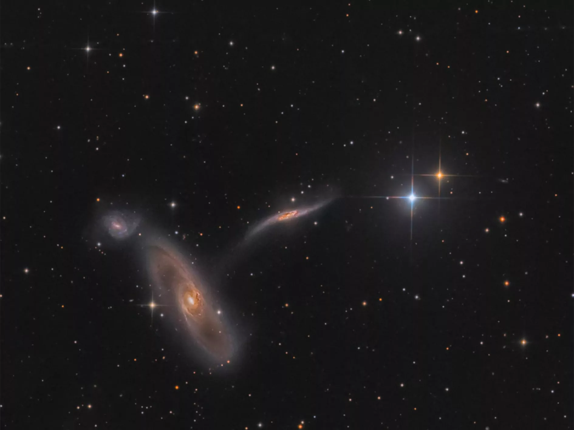 The photo shows a trio of interacting galaxies